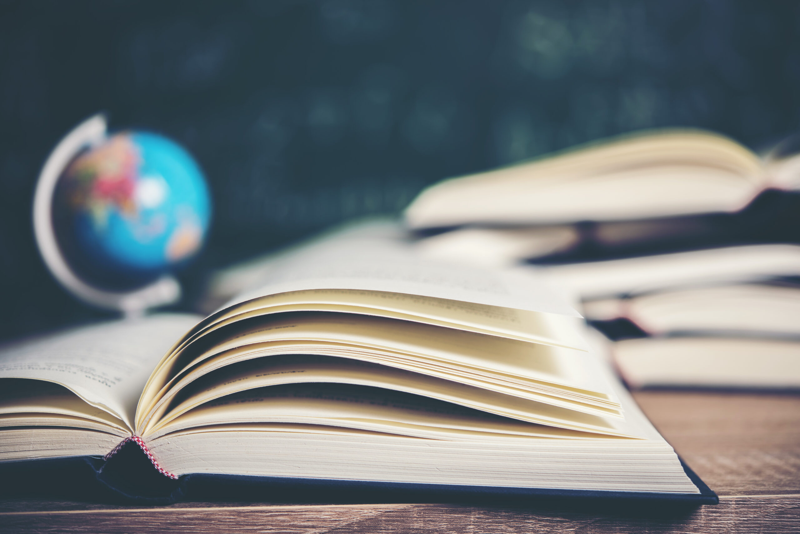 Open book with green board background